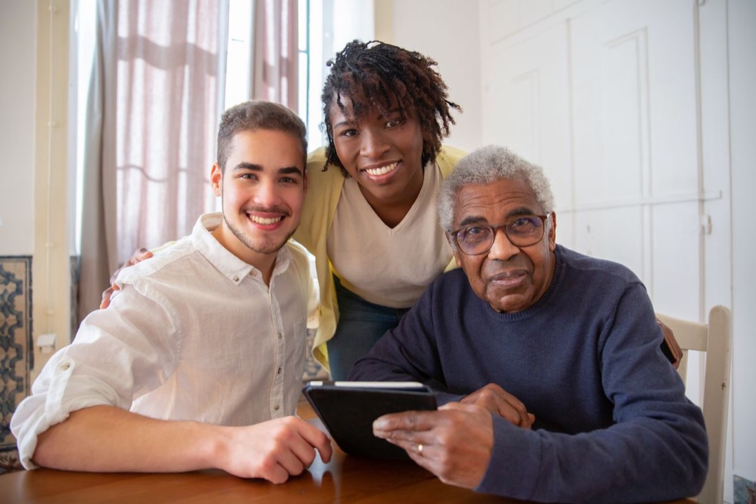 Three generations of a family sitting together reviewing options